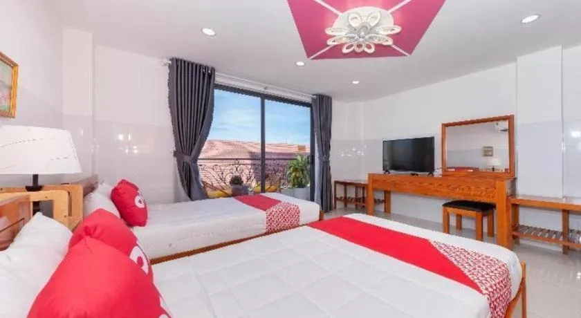 Bed in OYO 1028 Flower House Apartment