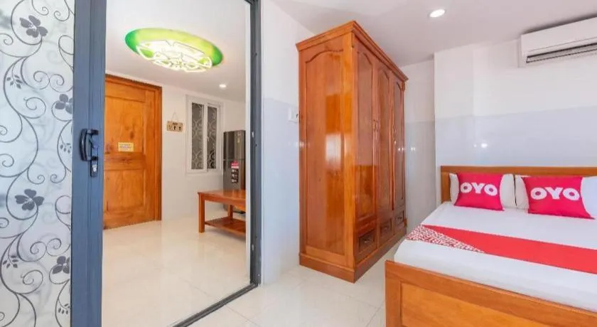 Bed in OYO 1028 Flower House Apartment