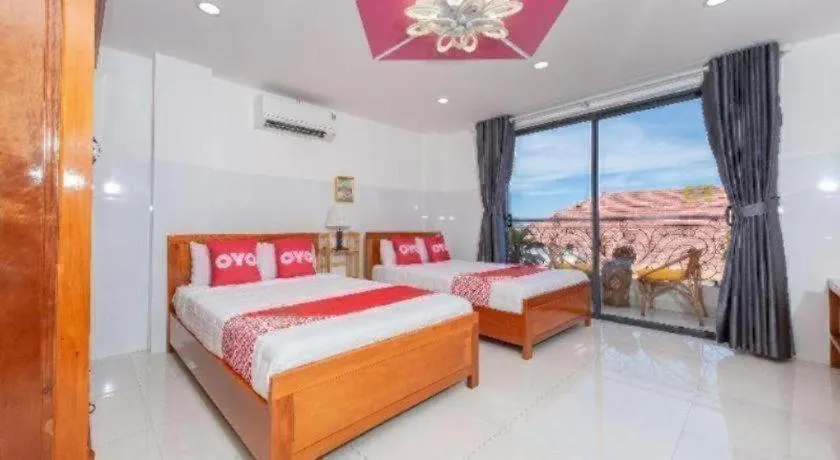 Bed in OYO 1028 Flower House Apartment