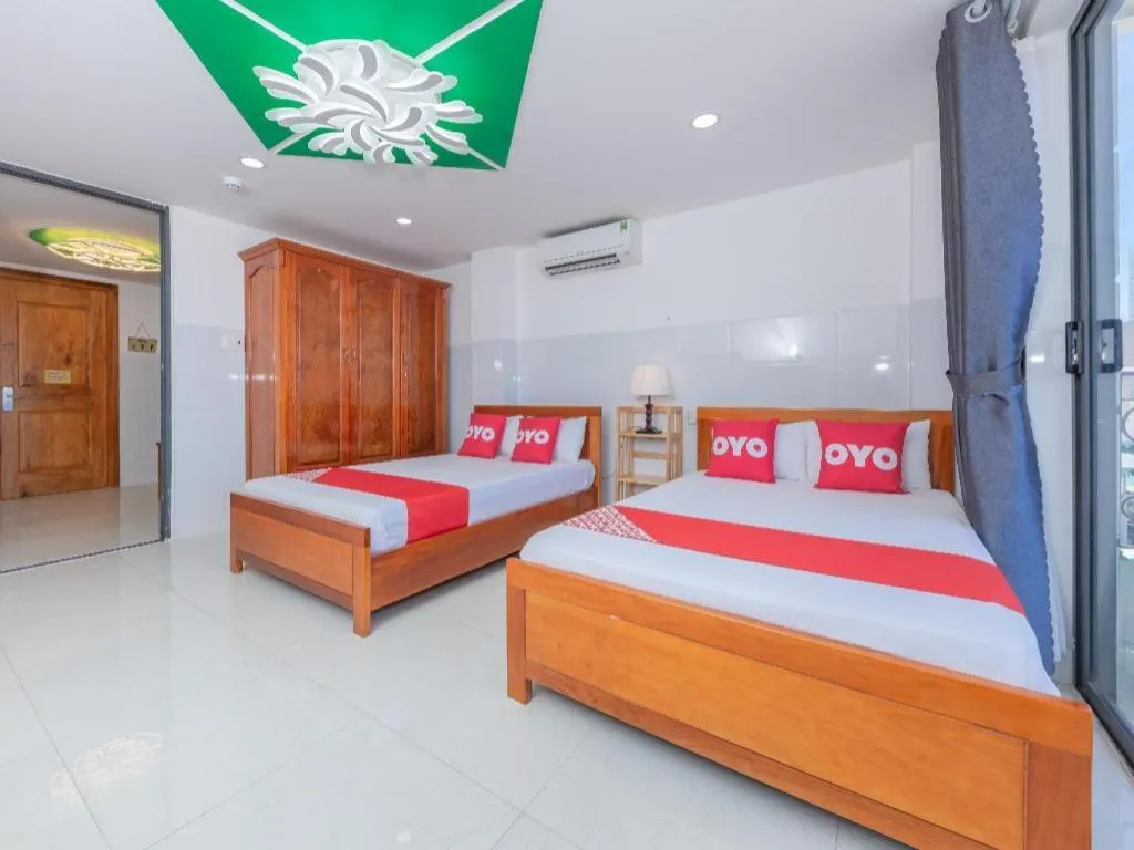 Bed in OYO 1028 Flower House Apartment