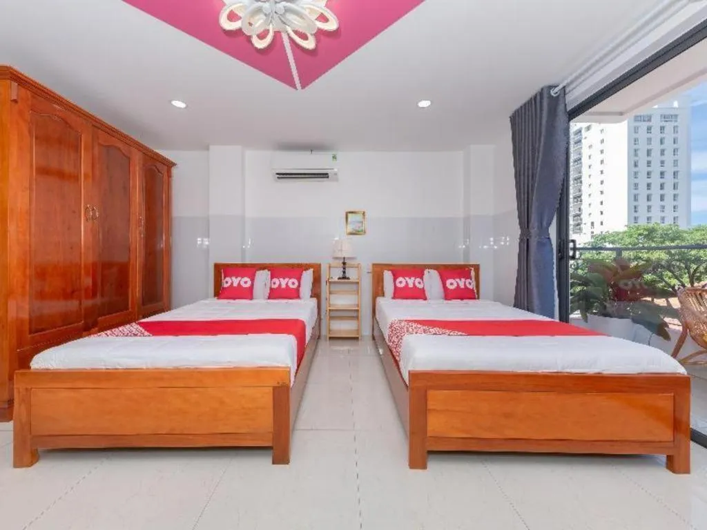 Bed in OYO 1028 Flower House Apartment