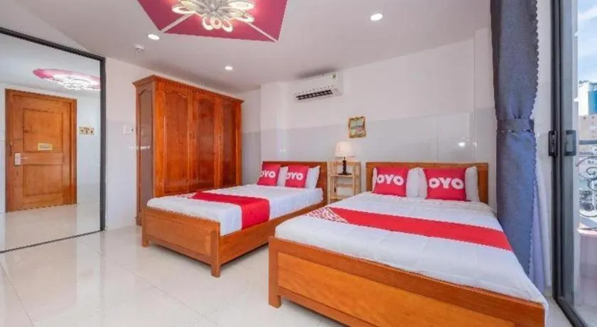 Bed in OYO 1028 Flower House Apartment