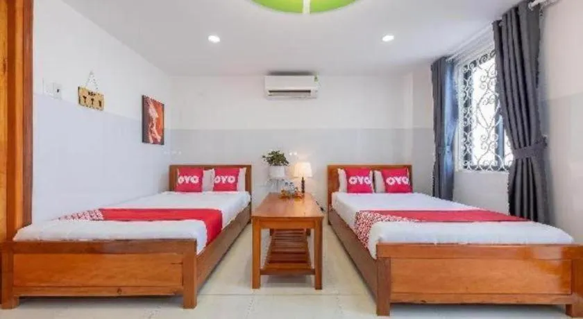 Bed in OYO 1028 Flower House Apartment