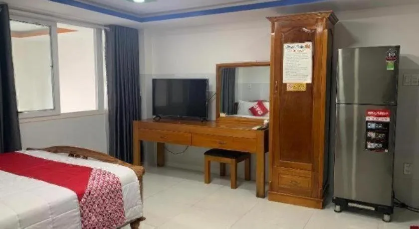 Bed in OYO 1028 Flower House Apartment