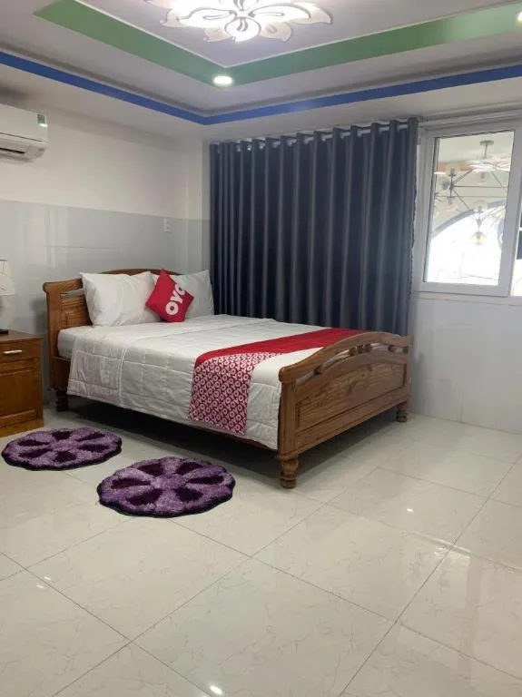 Bed in OYO 1028 Flower House Apartment