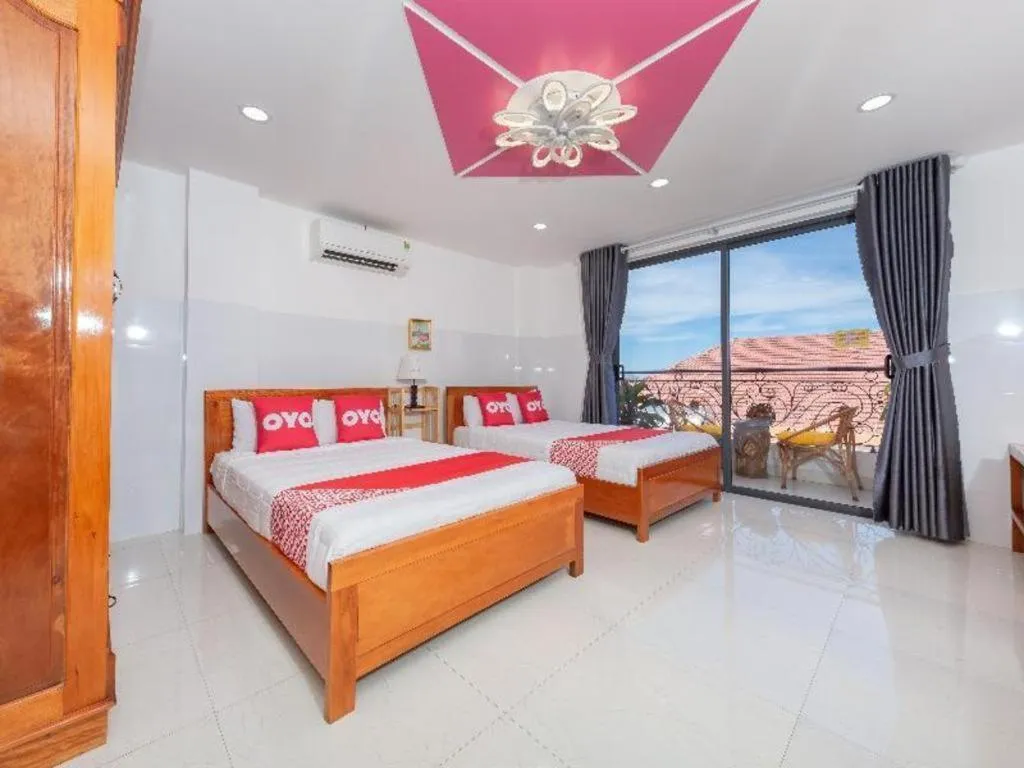 Bed in OYO 1028 Flower House Apartment