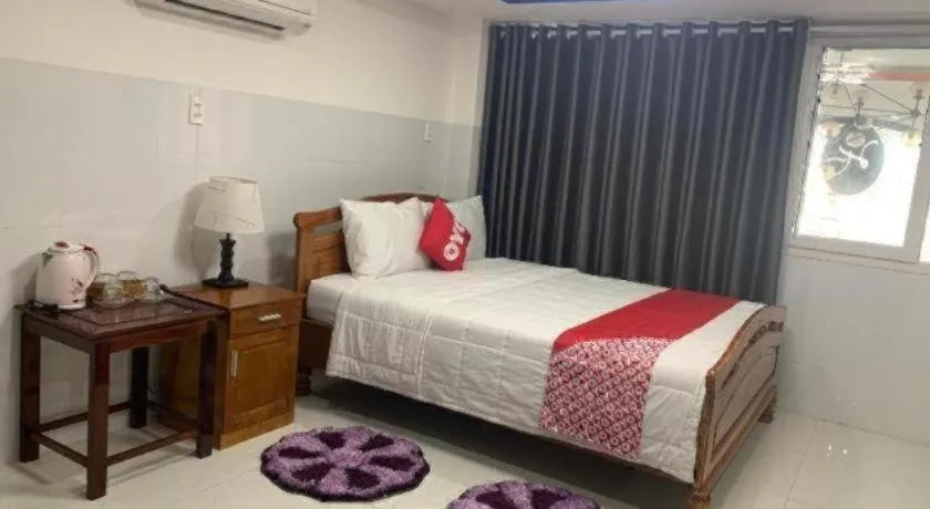 Bed in OYO 1028 Flower House Apartment