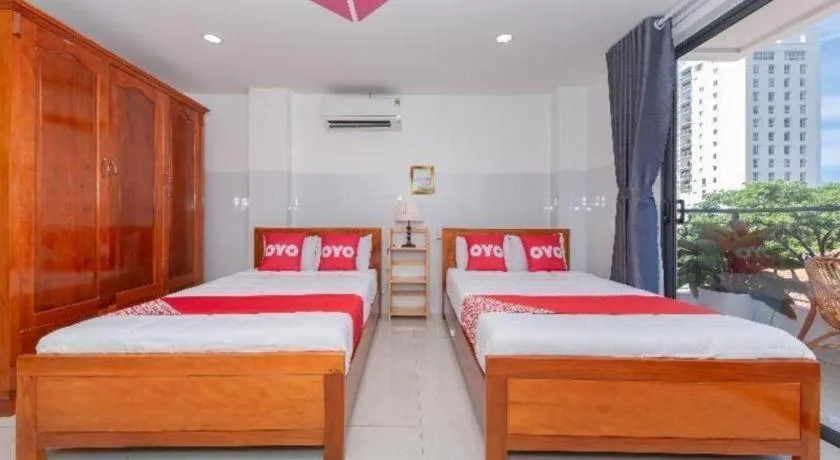 Bed in OYO 1028 Flower House Apartment