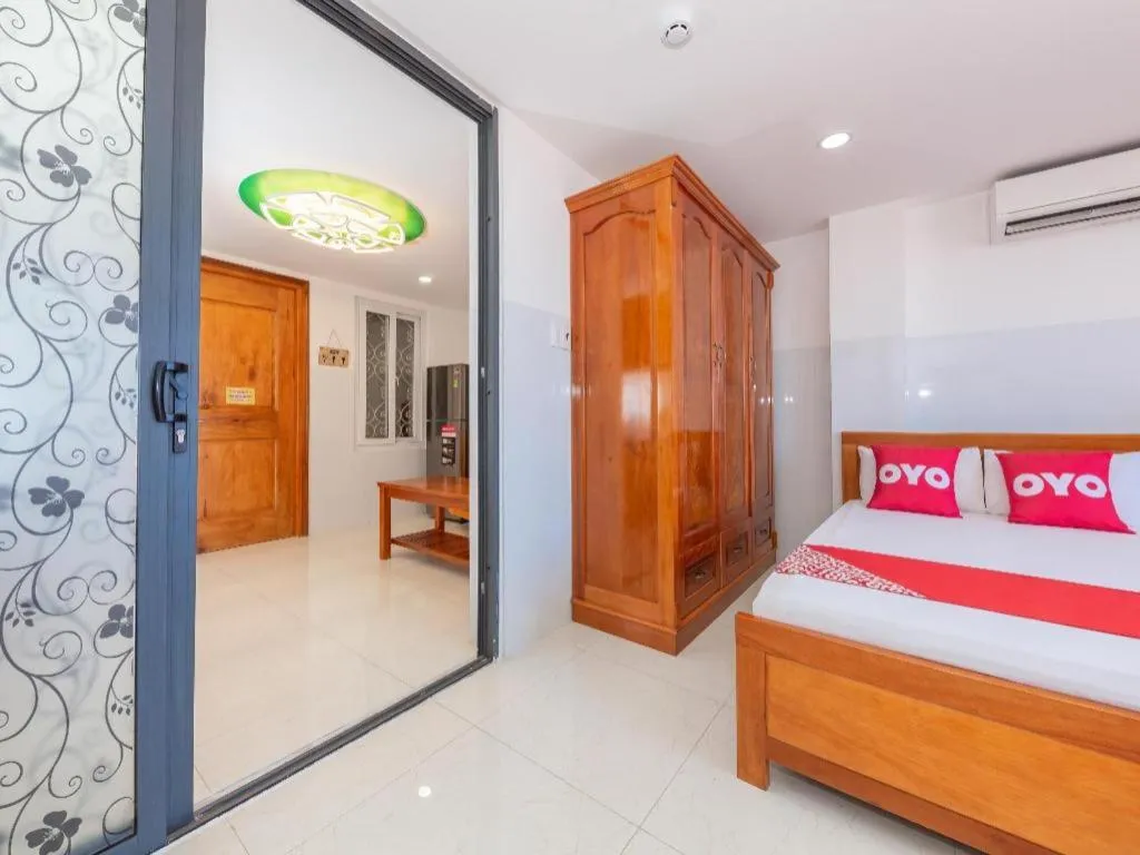 Bed in OYO 1028 Flower House Apartment