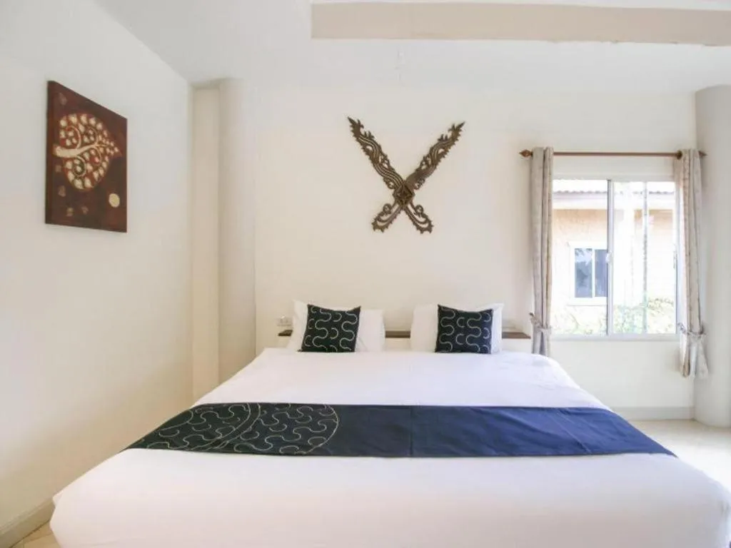 Bed in CAPITAL O961 Baan Dow Chompoo Resort