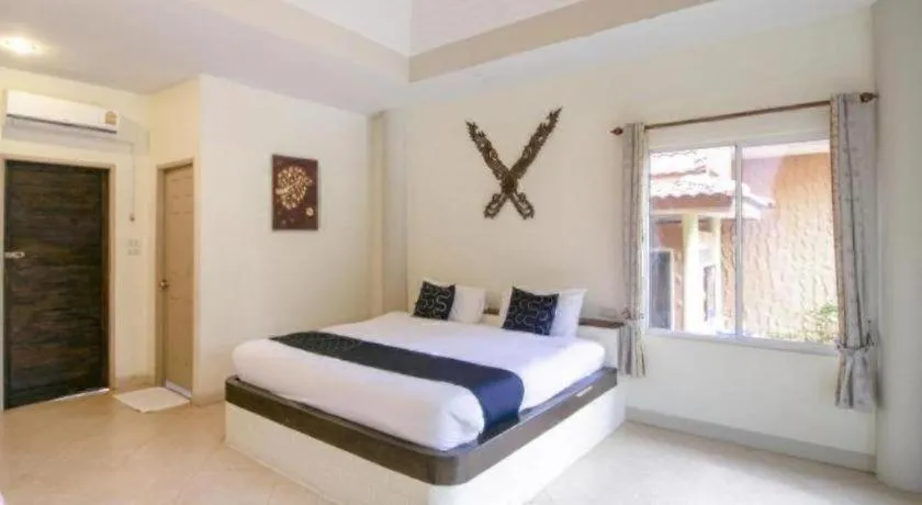 Bed in CAPITAL O961 Baan Dow Chompoo Resort