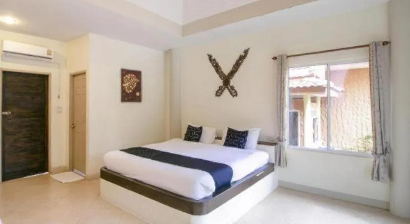 Bed in CAPITAL O961 Baan Dow Chompoo Resort
