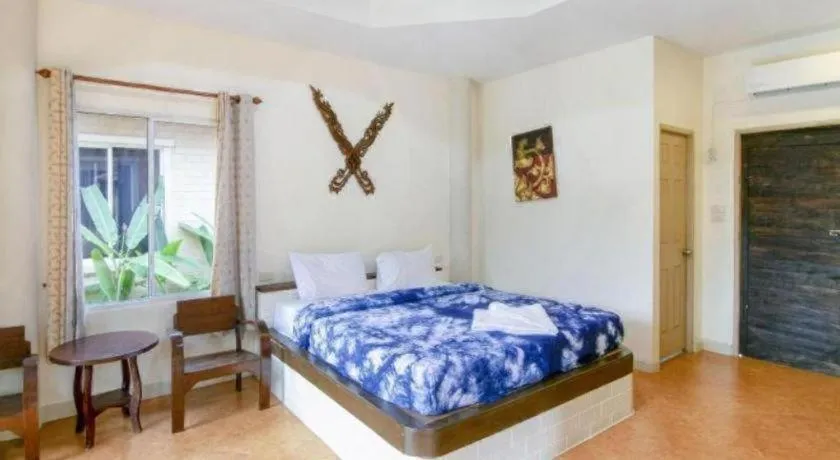 Bed in CAPITAL O961 Baan Dow Chompoo Resort