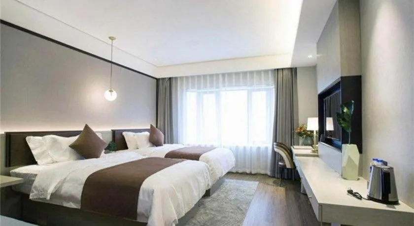 Bed in Gya Hotel Shanghai Long Distance Passenger Terminal Station