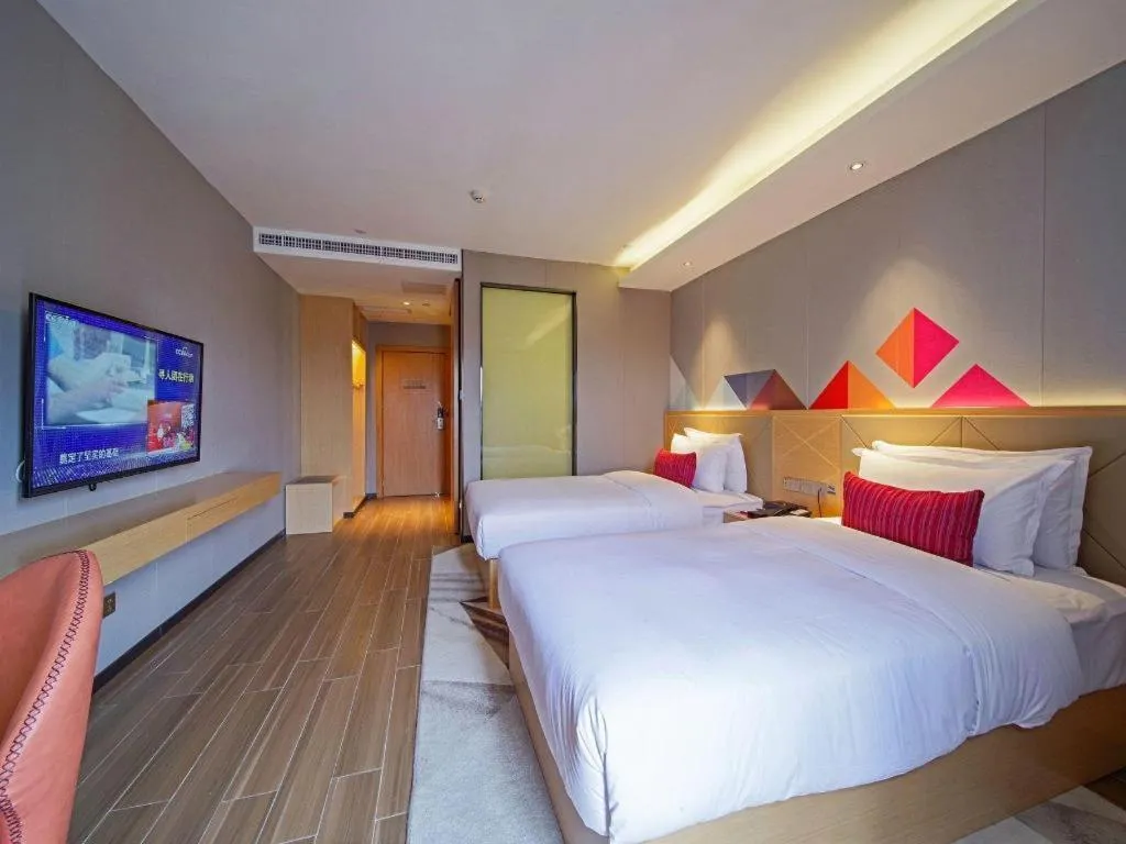 Bed in Borrman Hotel Zhaoqing Sihui Tianguangxu Jade City