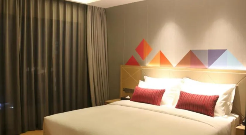 Bed in Borrman Hotel Zhaoqing Sihui Tianguangxu Jade City