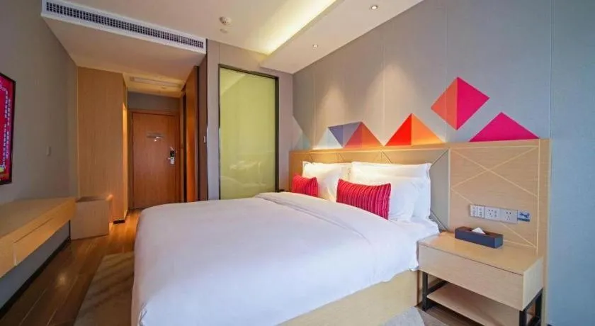 Bed in Borrman Hotel Zhaoqing Sihui Tianguangxu Jade City