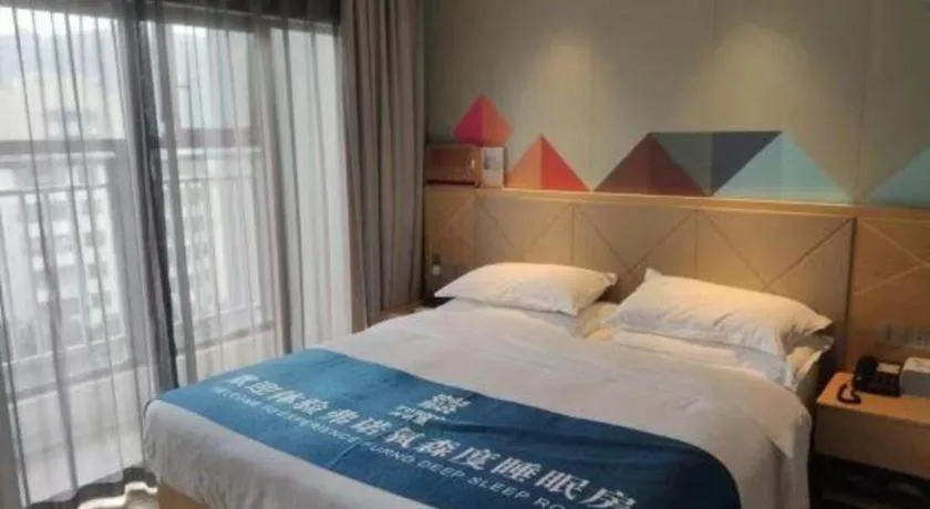 Bed in Borrman Hotel Zhaoqing Sihui Tianguangxu Jade City
