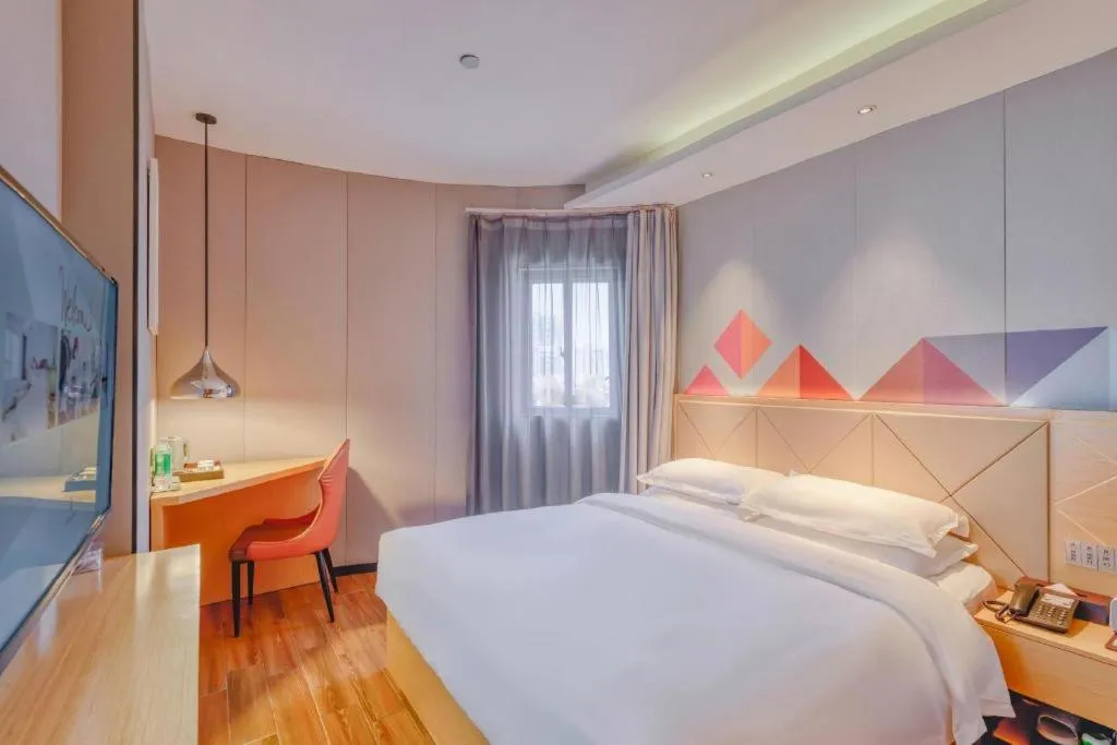 Bed in Borrman Hotel Zhaoqing Sihui Tianguangxu Jade City