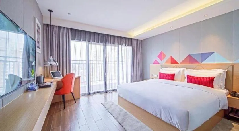 Bed in Borrman Hotel Zhaoqing Sihui Tianguangxu Jade City