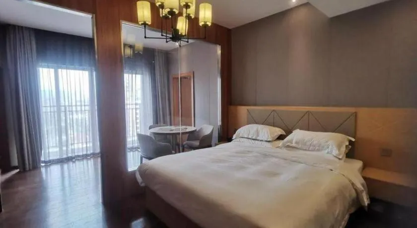 Bed in Borrman Hotel Zhaoqing Sihui Tianguangxu Jade City