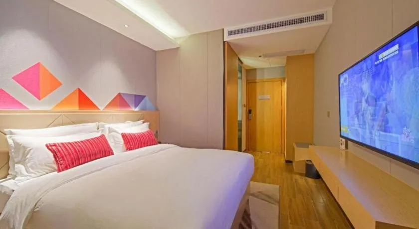 Bed in Borrman Hotel Zhaoqing Sihui Tianguangxu Jade City