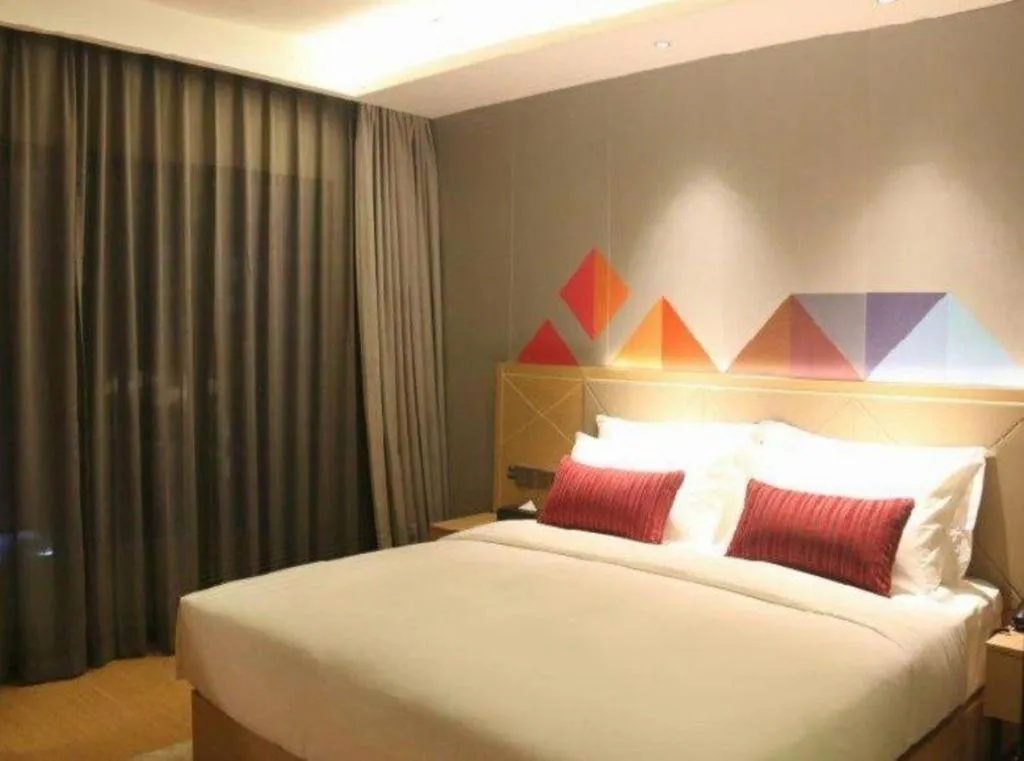 Bed in Borrman Hotel Zhaoqing Sihui Tianguangxu Jade City