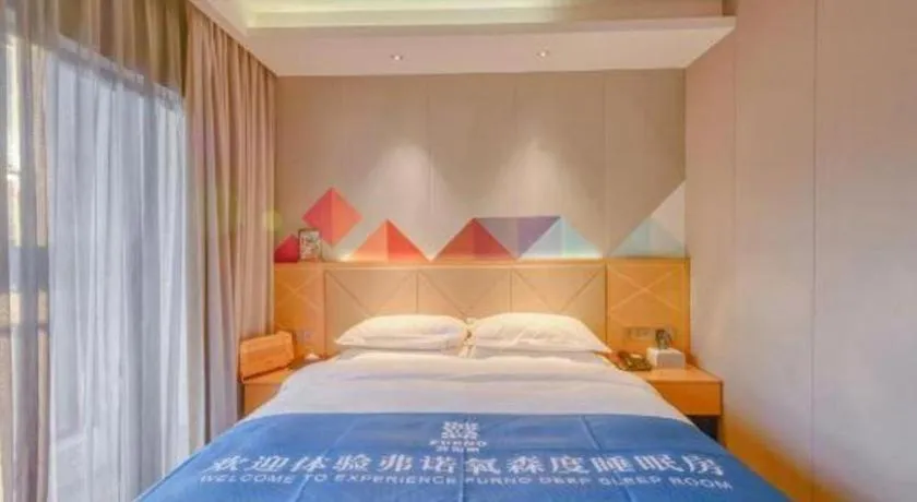 Bed in Borrman Hotel Zhaoqing Sihui Tianguangxu Jade City