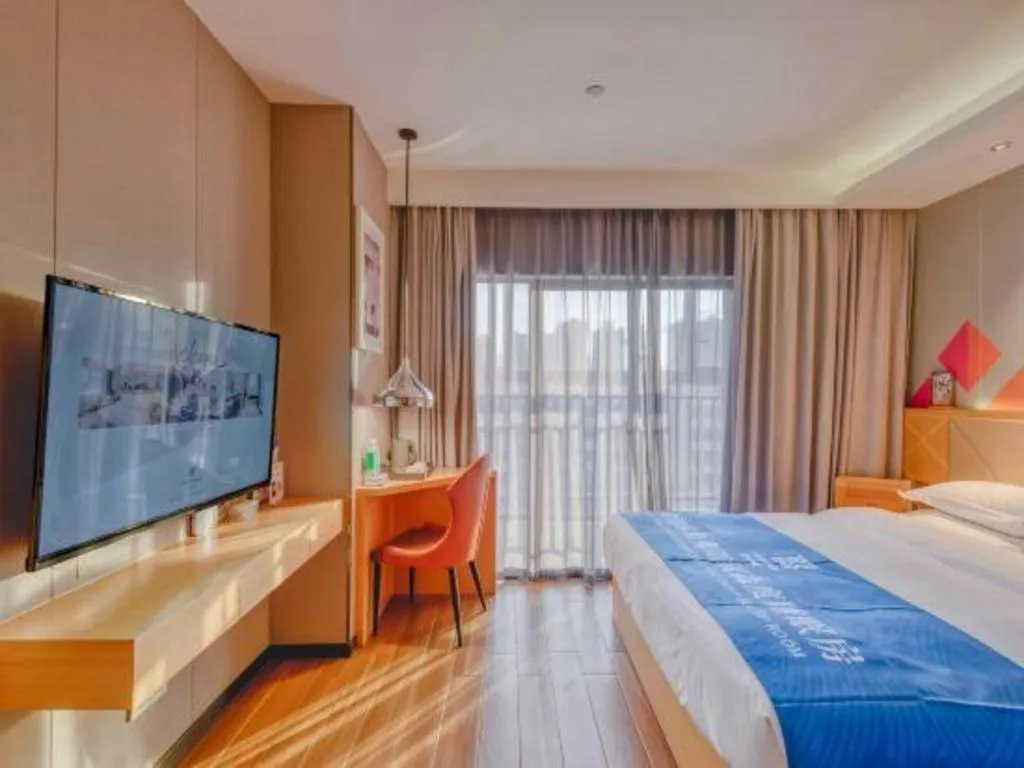 Bed in Borrman Hotel Zhaoqing Sihui Tianguangxu Jade City