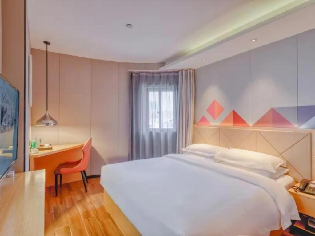 Bed in Borrman Hotel Zhaoqing Sihui Tianguangxu Jade City