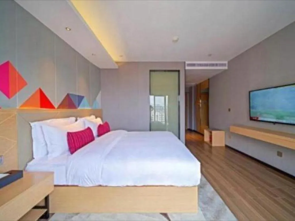 Bed in Borrman Hotel Zhaoqing Sihui Tianguangxu Jade City