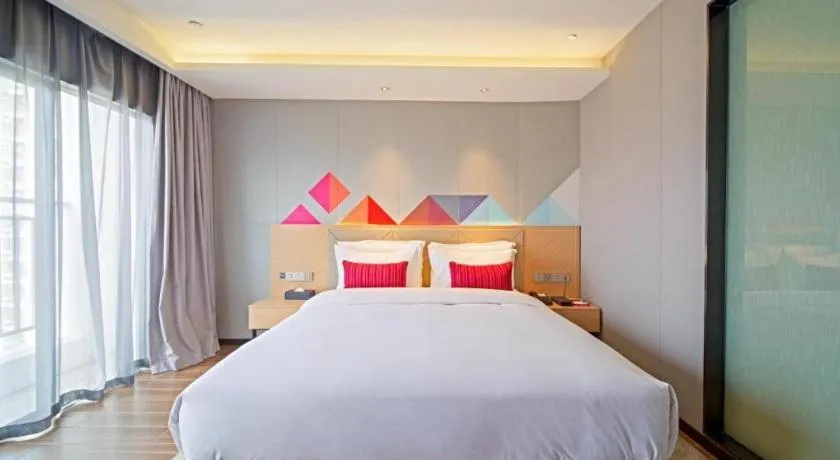 Bed in Borrman Hotel Zhaoqing Sihui Tianguangxu Jade City