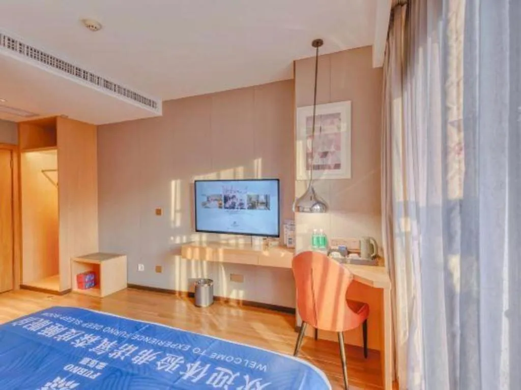 Bed in Borrman Hotel Zhaoqing Sihui Tianguangxu Jade City