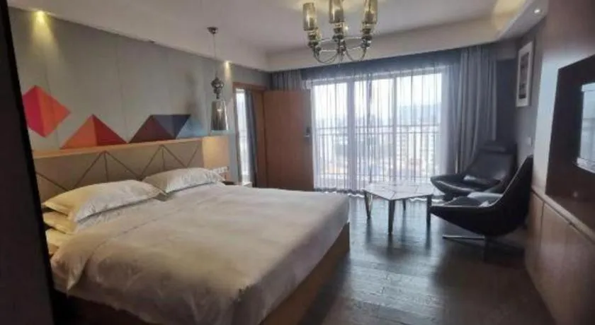 Bed in Borrman Hotel Zhaoqing Sihui Tianguangxu Jade City