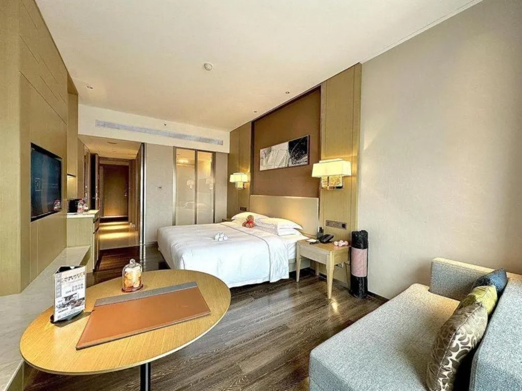 Bed in Derayco Hotel Foshan