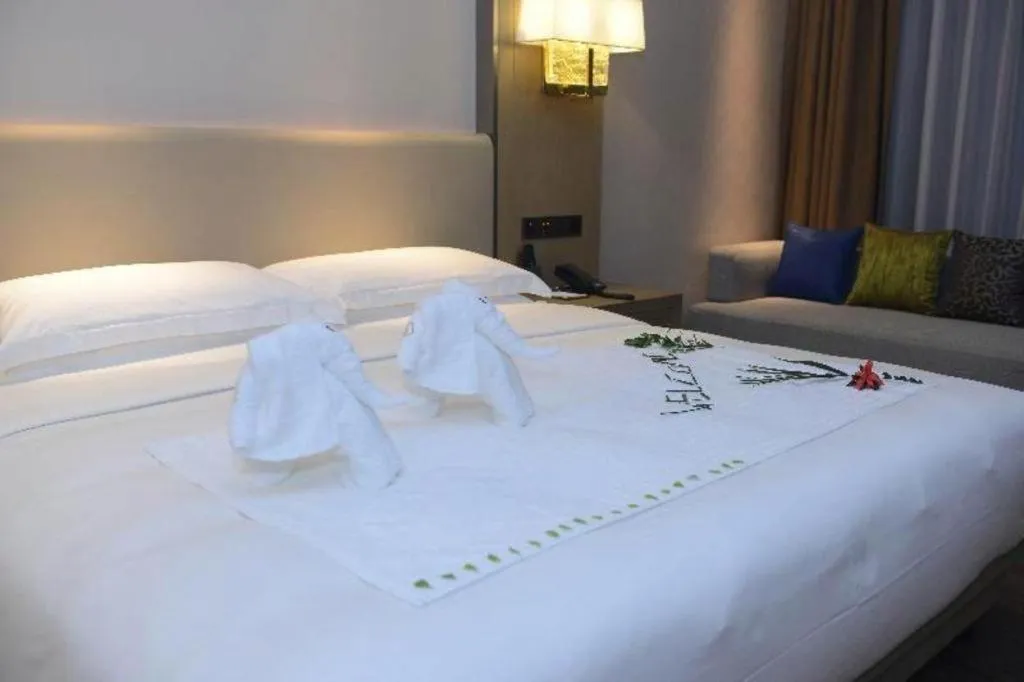 Bed in Derayco Hotel Foshan