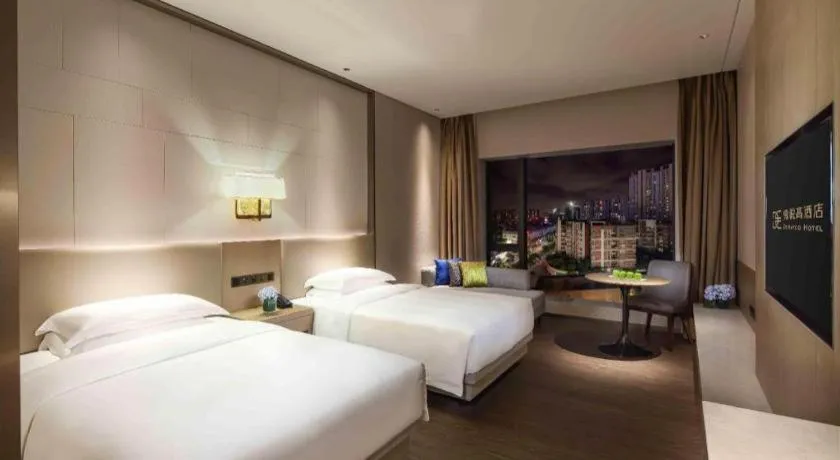 Bed in Derayco Hotel Foshan