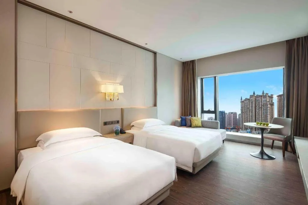 Bed in Derayco Hotel Foshan