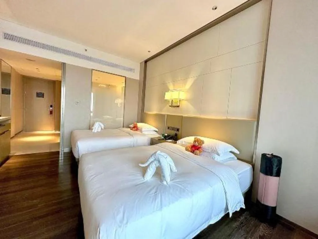 Bed in Derayco Hotel Foshan