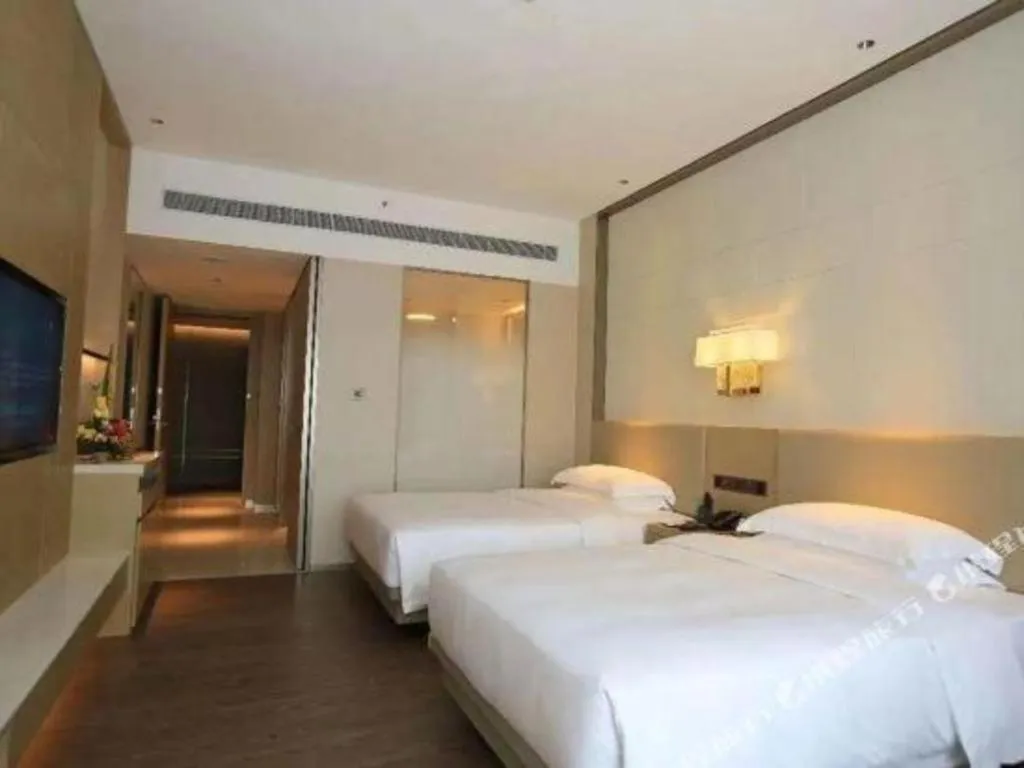 Bed in Derayco Hotel Foshan