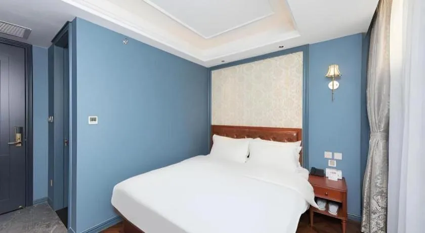 Bed in Yitingzhenshe Hotel Beijing Qianmen