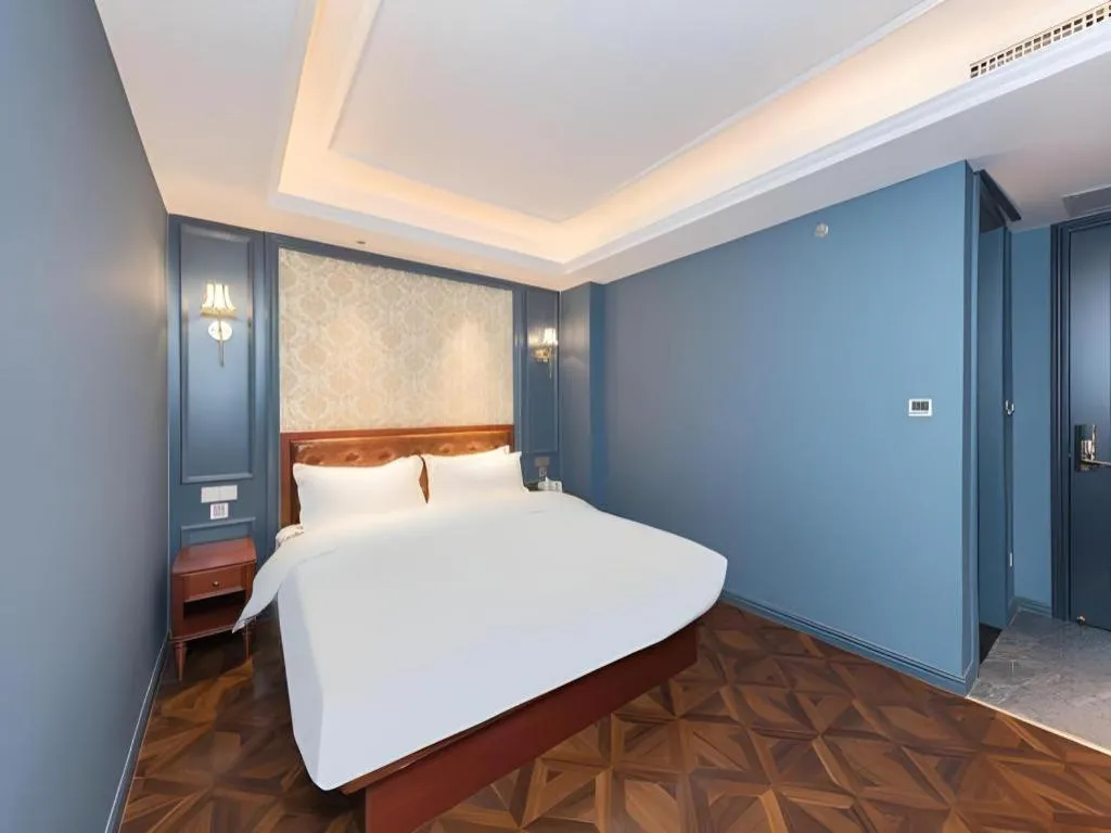 Bed in Yitingzhenshe Hotel Beijing Qianmen