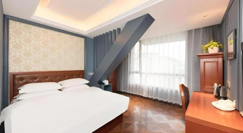 Bed in Yitingzhenshe Hotel Beijing Qianmen