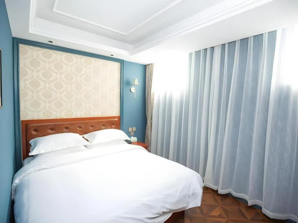 Bed in Yitingzhenshe Hotel Beijing Qianmen