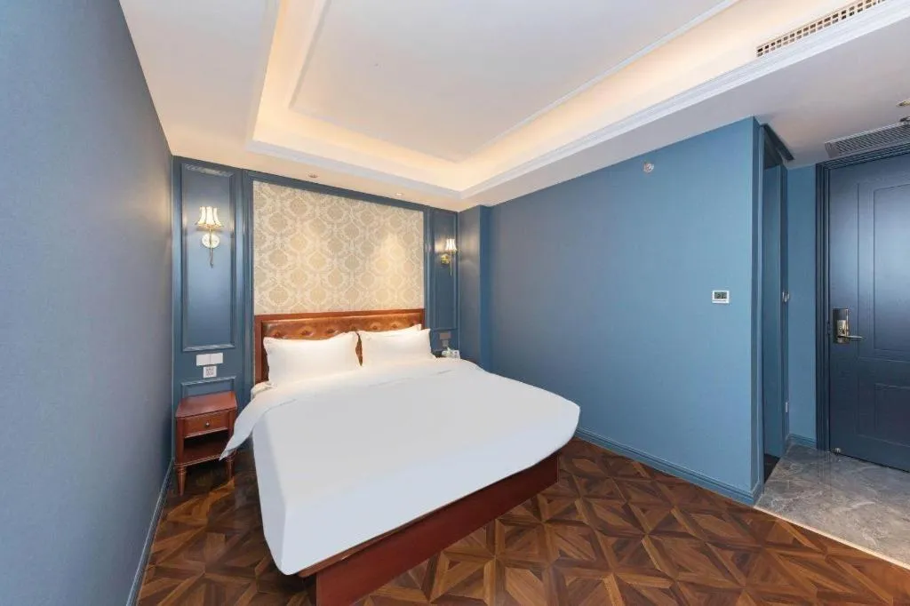 Bed in Yitingzhenshe Hotel Beijing Qianmen