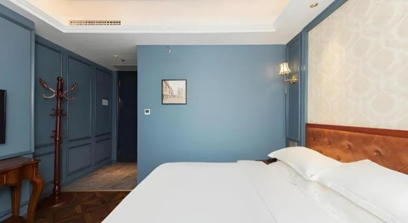 Bed in Yitingzhenshe Hotel Beijing Qianmen