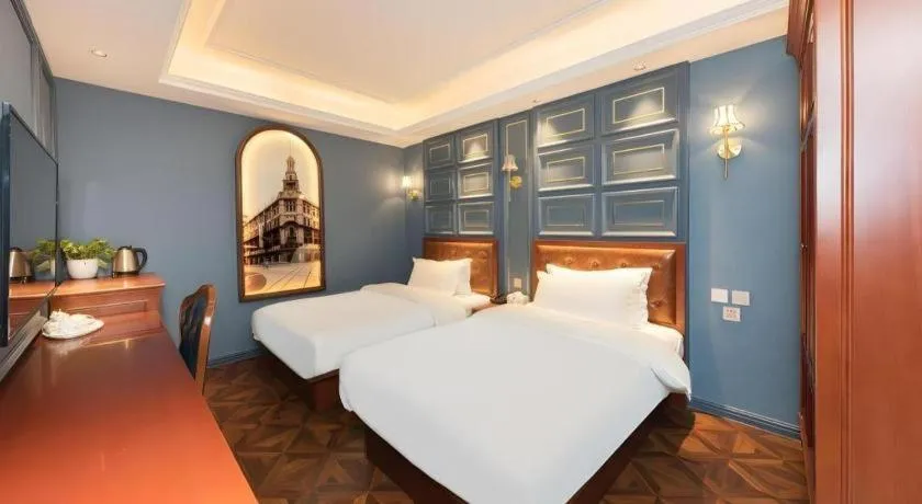 Bed in Yitingzhenshe Hotel Beijing Qianmen