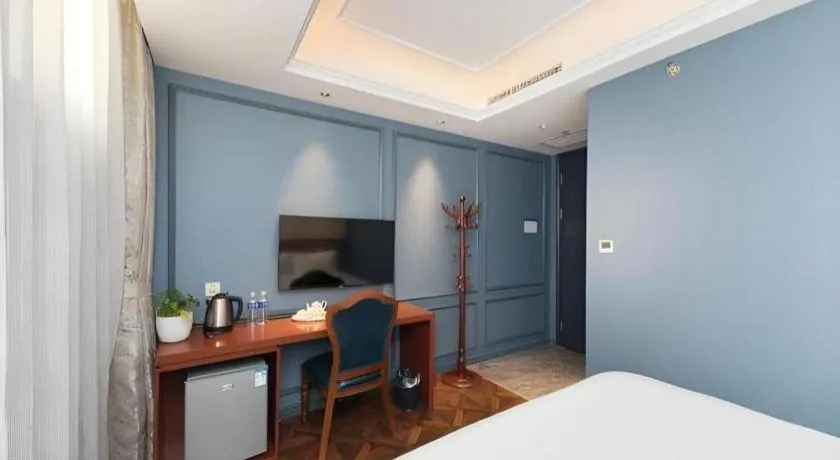 Bed in Yitingzhenshe Hotel Beijing Qianmen