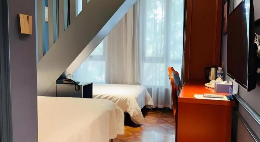 Bed in Yitingzhenshe Hotel Beijing Qianmen