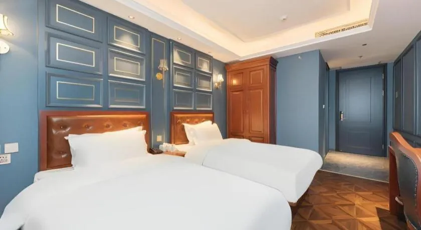 Bed in Yitingzhenshe Hotel Beijing Qianmen